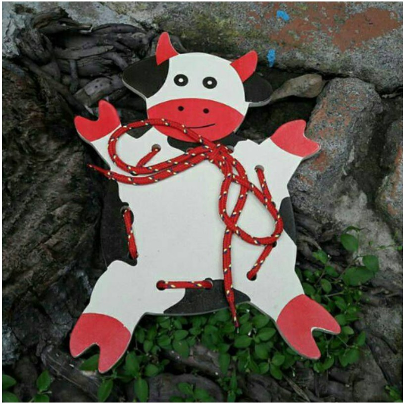 MENJAHIT SAPI KAYU