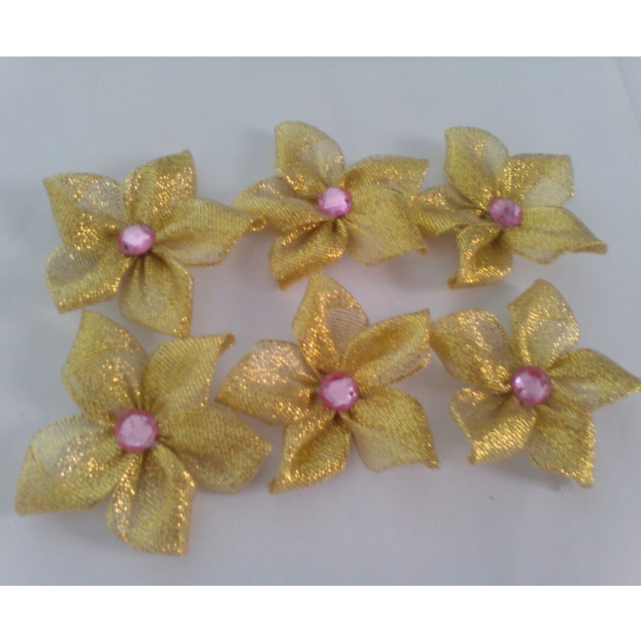 bross bunga gliter emas