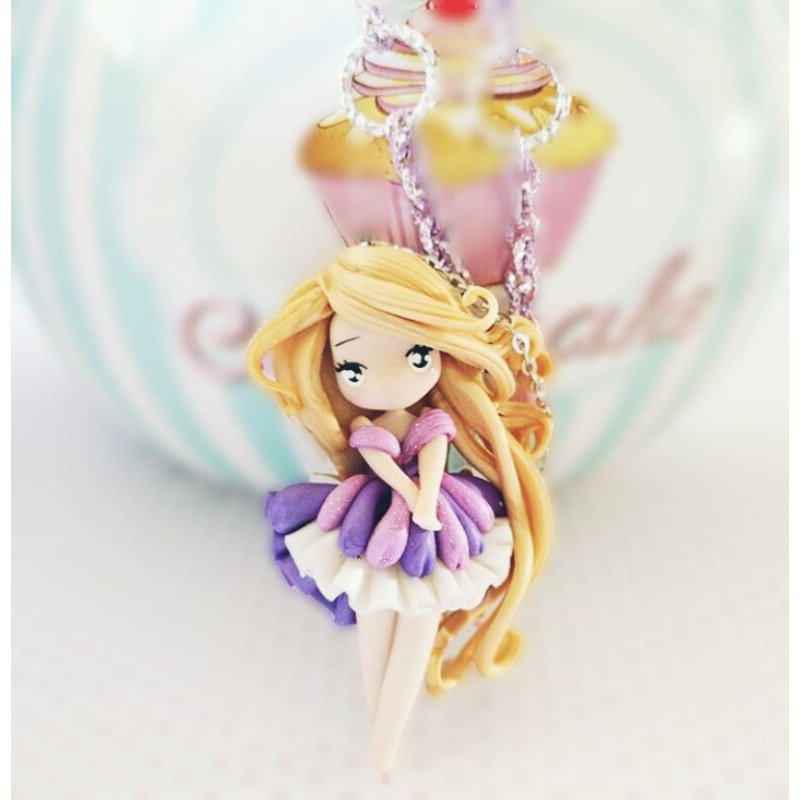 Clay doll pendant