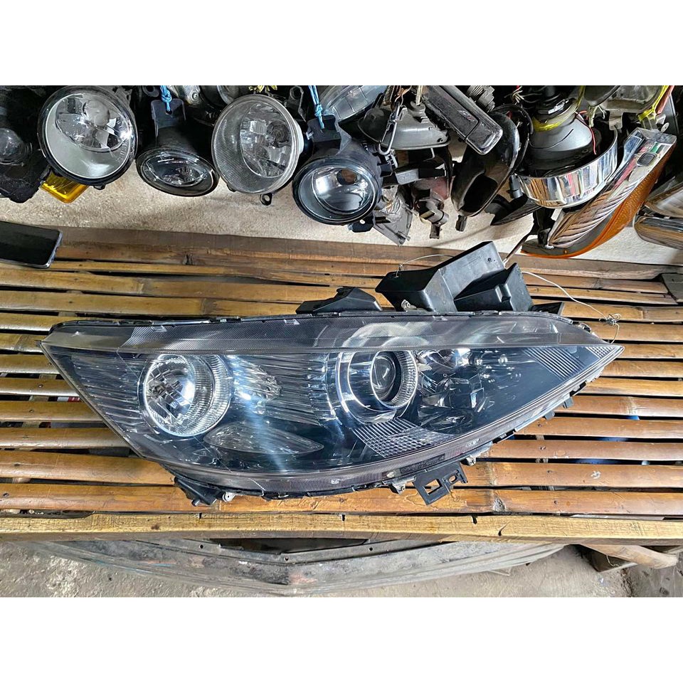 headlamp mazda biante original 100%