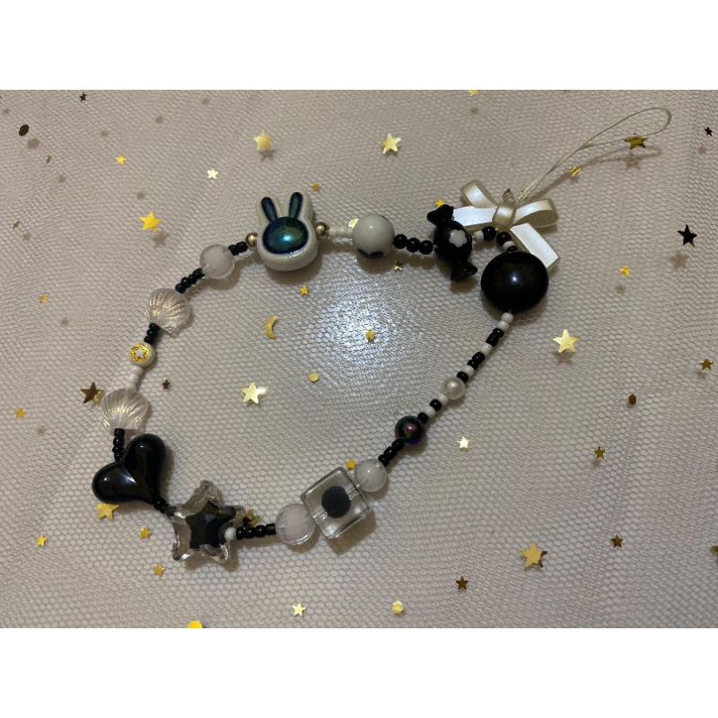 strap phone hitam premi
