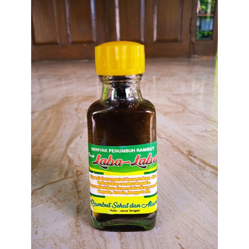 penumbuh rambut cap Laba-laba