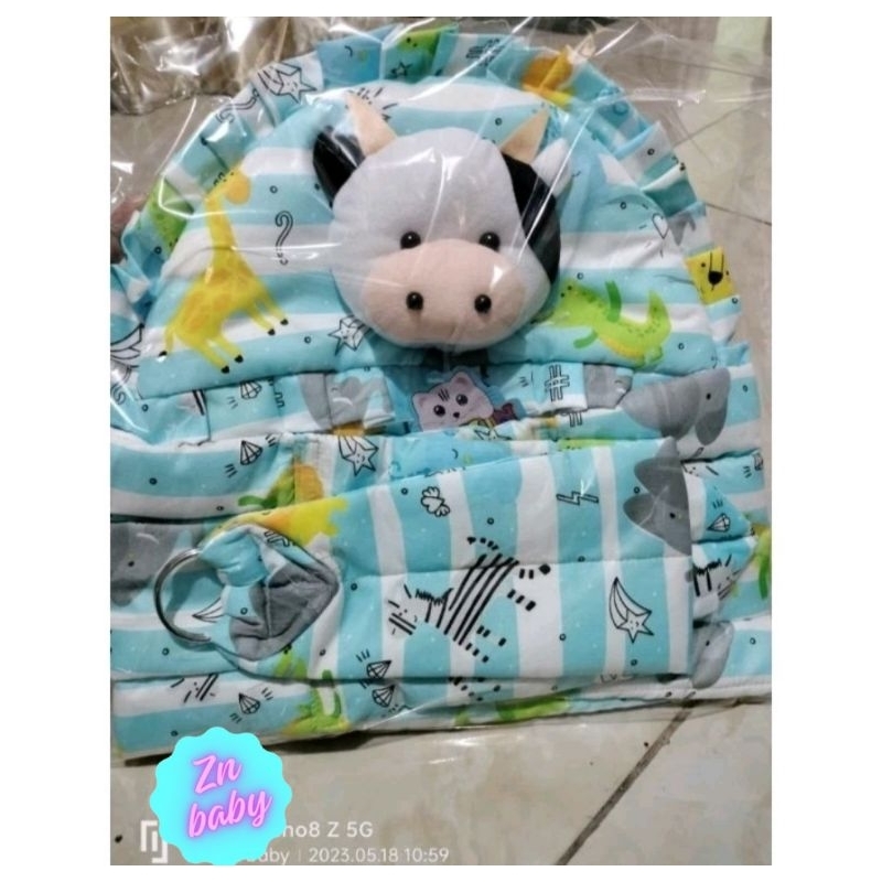 Gendongan bayi kepala sapi