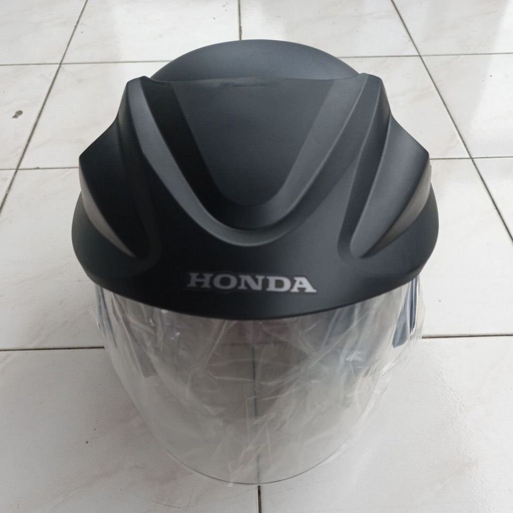 Helm original bawaan motor
