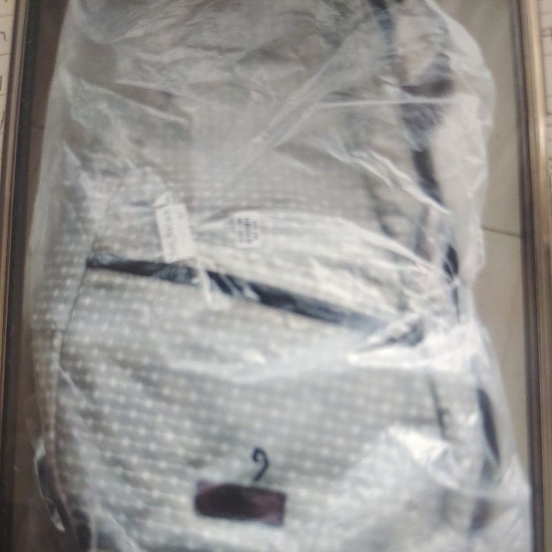 tas Yuni oei
