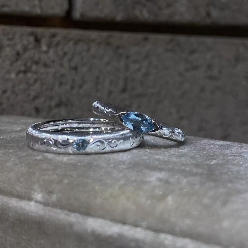 The ring features an open, adjustable design that is versatile and stylish