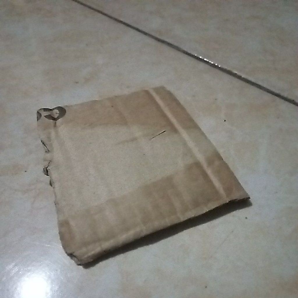 kardus ganjal pintu