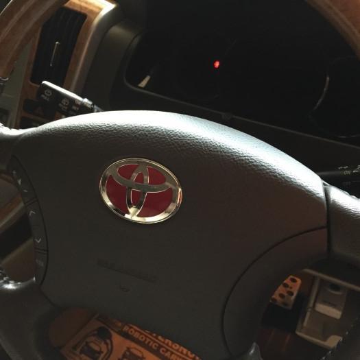 Red Emblem Steer Toyota